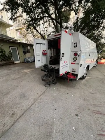 Magnet Plumbing service vehicle on-site for Grease Trap Cleaning in Winter Park